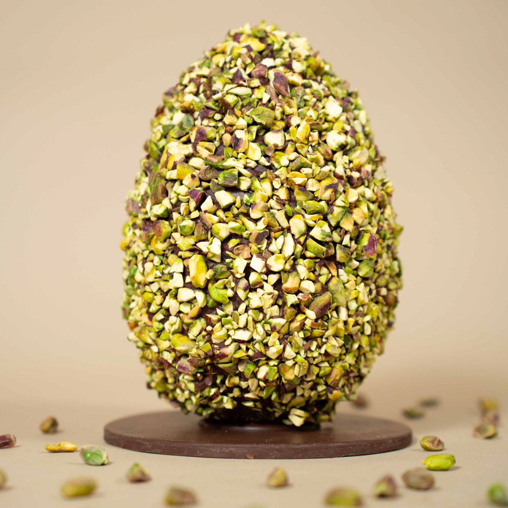 Milk chocolate egg with pistachios
